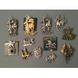 Twelve Jonette Jewelry pin brooches Depicting Pegasus, winged bull and dragon. IMPORTANT: Online