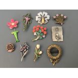 Nine Jonette Jewelry flower pin brooches and one badge. IMPORTANT: Online viewing and bidding