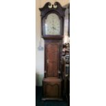 An oak cased grandfather clock with column detail and painted bird to face, height approximately 2.