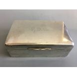 A silver cased weighted cigarette box, marked ‘F.D.S’ to top. IMPORTANT: Online viewing and
