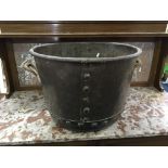 A large copper riveted log bucket with two brass handles. IMPORTANT: Online viewing and bidding