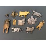 Ten Jonette Jewelry cow pin brooches and one badge. IMPORTANT: Online viewing and bidding only. No