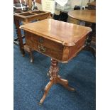 A 19th century walnut lift up top sewing table on single column tripod base. IMPORTANT: Online