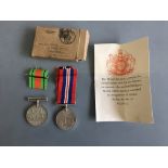 World War Two Defence and War medals in box addressed to Mr R.O. Taylor. IMPORTANT: Online viewing