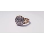 A yellow gold18ct diamond cluster ring of domed form set with 19 small diamonds, ring size R,