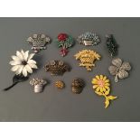 Eight Jonette Jewelry flower pin brooches and one badge. IMPORTANT: Online viewing and bidding only.