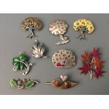 Nine Jonette Jewelry tree and leaf pin brooches. IMPORTANT: Online viewing and bidding only. No in