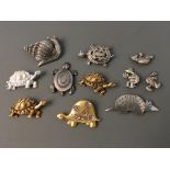 Eight Jonette Jewelry pin brooches and three badges depicting tortoise, snail and aardvark.