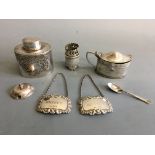 A collection of silver including lidded box, whisky and brand labels, mustard pot, small teaspoon