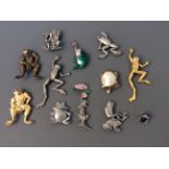 Eleven Jonette Jewelry frog pin brooches and one badge. IMPORTANT: Online viewing and bidding