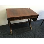 A reproduction four drawer drop leaf sofa table on harp style base, height 74.5cm, leaves down width