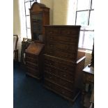 A mahogany reproduction single glazed door bureau