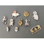Eight Jonette Jewelry pig pin brooches with two badges. IMPORTANT: Online viewing and bidding