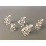 Four Swarovski squirrels with one rabbit, three boxed. IMPORTANT: Online viewing and bidding only.