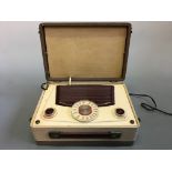 A red and cream two tone lidded radio. IMPORTANT: Online viewing and bidding only. No in person