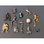 Eleven Jonette Jewelry frog pin brooches and one badge. On line viewing and bidding only. No in