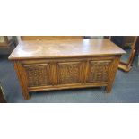 A Thomas Clarkson & Son oak blanket box with three Gothic style panels to front. IMPORTANT: Online