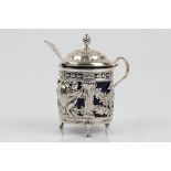 A Victorian silver mustard pot with blue glass liner