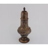 A silver hallmarked sugar shaker with decorative pattern, approx. height17cms. On line viewing and