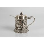 A silver mustard pot with glass liner with marks for London 1863