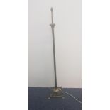 A brass standard lamp in the form of a Grecian column on a black marble base. IMPORTANT: Online
