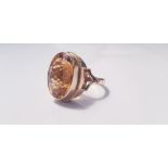 A yellow gold marked 375, Citrine ring, ring size O, approx. weight 7gms. On line viewing and