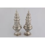 A Victorian pair silver pepper pots with marks for London 1896