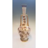 A Royal Worcester two handled vase, decorated gilded and floral detail, height approx. 39cm.
