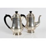 A silver hallmarked coffee pot with lid black nozzle, black handle,(lid broken/loose) approx. height