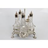 A George II glass and silver 5 bottle sauce/cruet set