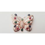 WITHDRAWN. A yellow gold marked 18k butterfly style brooch with emeralds, rubies, sapphires on