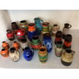 Twenty two West German pottery vases and jugs in various colours and patterns. IMPORTANT: Online