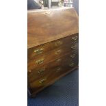A mahogany Georgian four drawer writing bureau. IMPORTANT: Online viewing and bidding only.