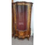 A French kingwood single glazed door glass panel side display cabinet decorated with brass leaf