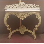 An early to mid 20th century French white marble console table with pierced raised back repainted