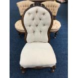 A 19th century cream upholstered nursing chair.