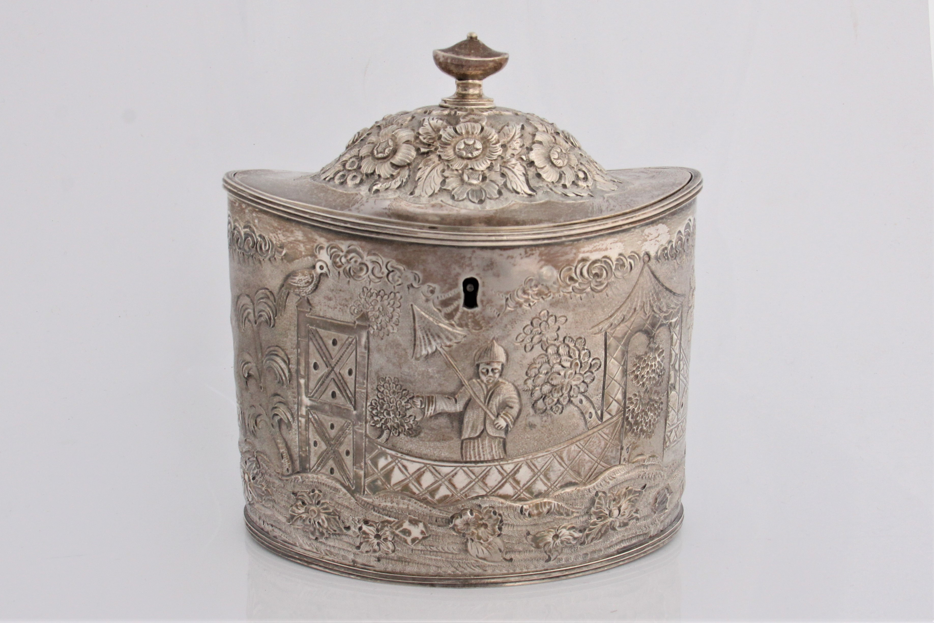 A George III silver oval tea caddy with stylised Chinese decoration marks for London 1798