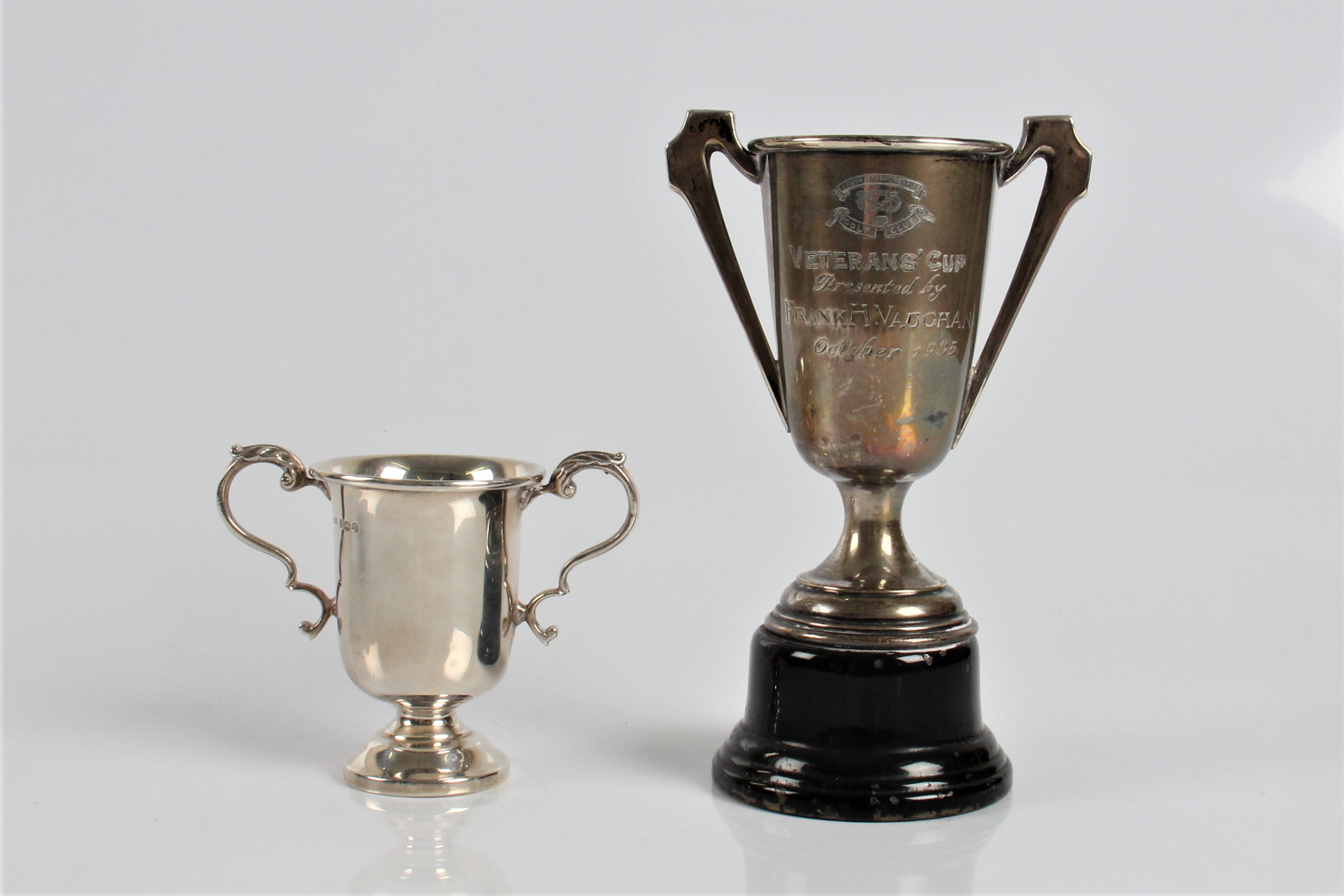 Two silver hallmarked two handled trophy on stands