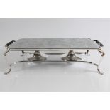 A two burner silver plate hot plate. No in person collections, an additional charge of £30 (incl.