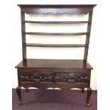 An oak Jacobean style two drawer kitchen dresser with a three shelf plate rack. IMPORTANT: Online