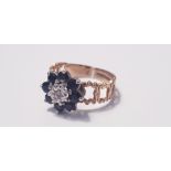 A 9ct yellow gold sapphire and diamond cluster ring set with 8 dark blue sapphires, ring size O,
