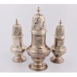A set of three George II silver sugar casters/spice pots marks for London 1742 and Samuel Wood