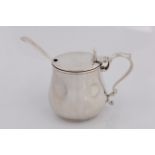 A Victorian silver mustard pot with marks for Birmingham 1863 Elkington & Co