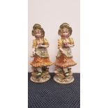 A pair of Capodimonte large figurines, girls wearing bonnets, height 66cm. IMPORTANT: Online viewing