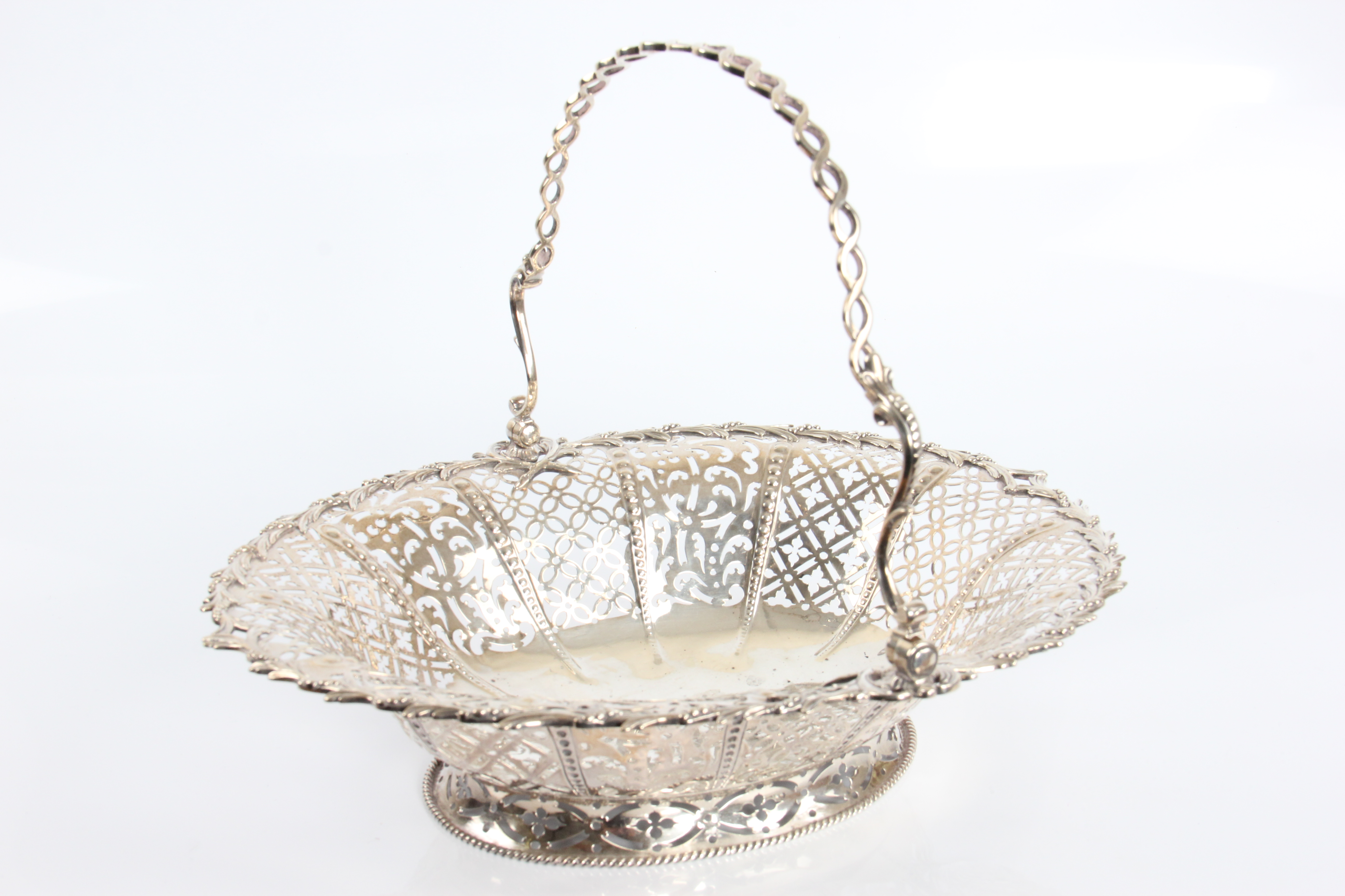 A George IV silver basket with loop handle