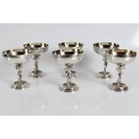 A set of six silver matching wine goblets, decorated stem of Pan surrounded by grapevines and