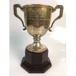 A silver two handled mounted on bakelite trophy marked 'R.A.C. Caravan Rally Cheltenham 1933 Skilful