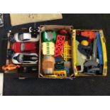 Five boxes of children’s toys including remote control cars, with model trains and train set.