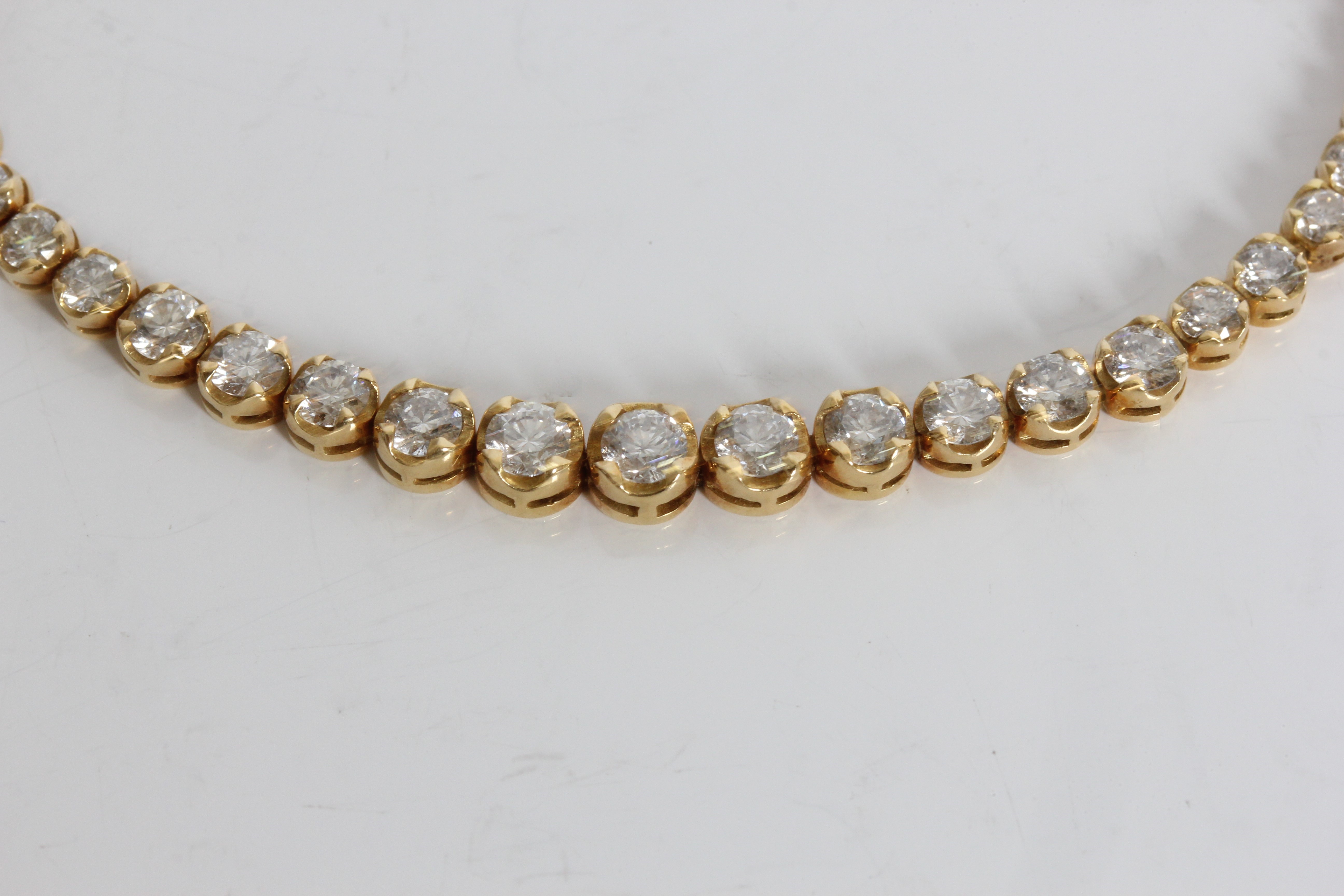 A yellow gold marked 750 graduated diamond tennis bracelet, approx. weight 9.65gms, approx. length - Image 4 of 5