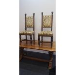 A John Taylor & Son Edinburgh oak refractory dining table together with six turned and fluted legged